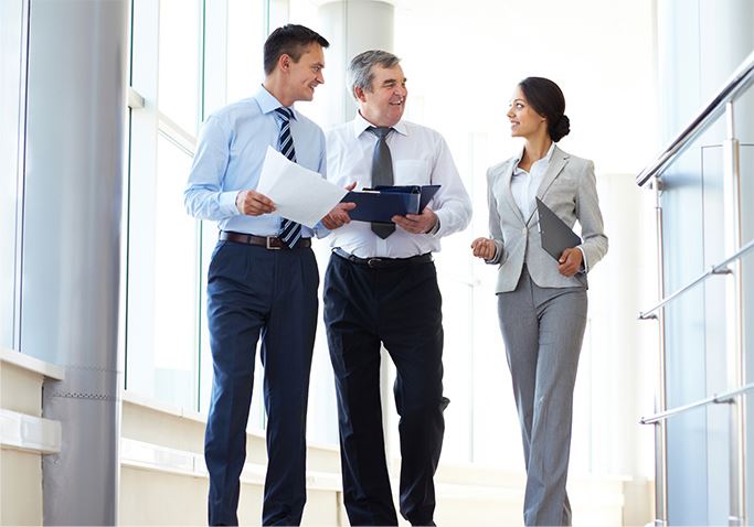 People walking and talking at work